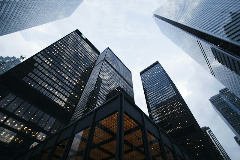 Upward perspective of modern city buildings representing an evolving marketplace